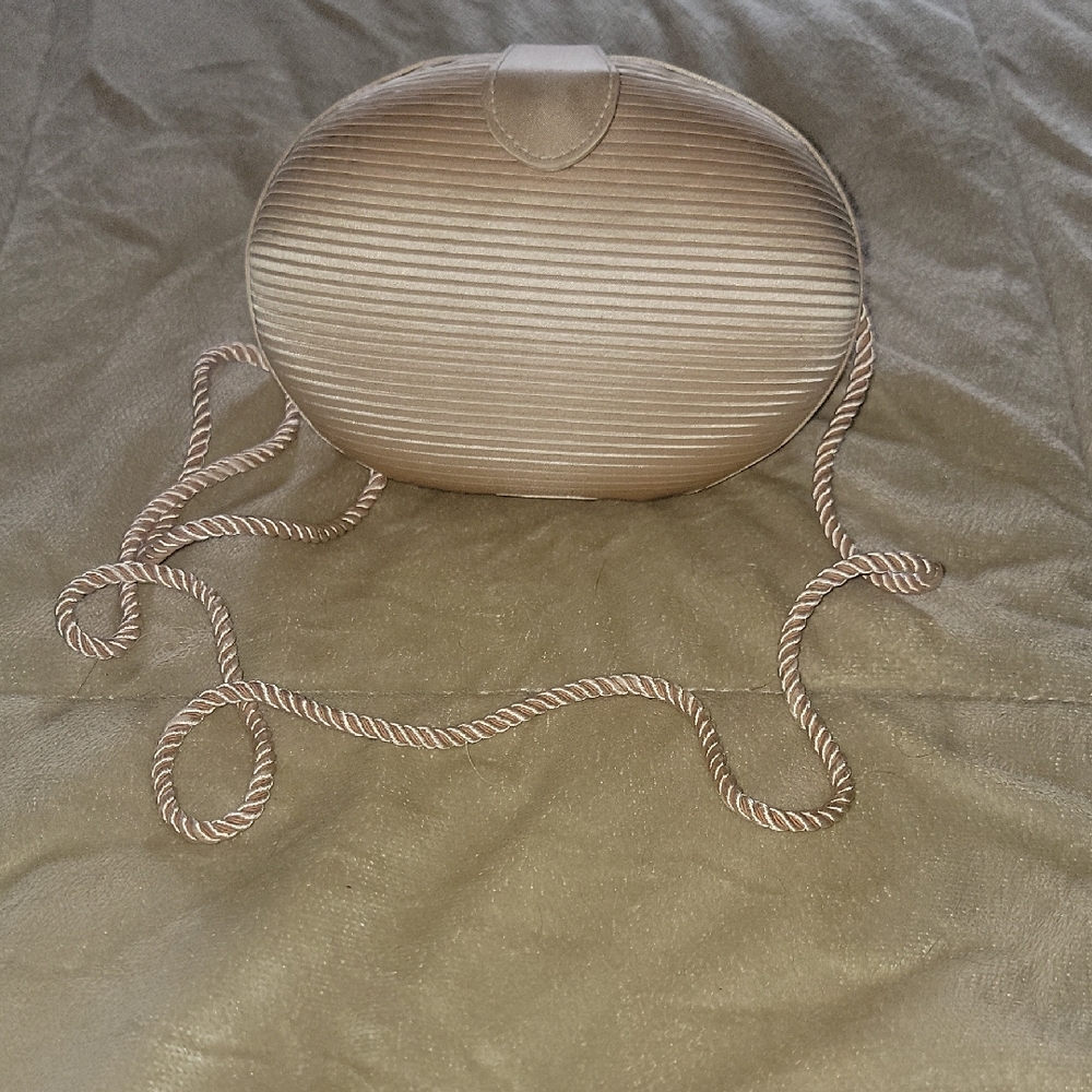 Vintage Marshall Fields Elegant Tan Oval Clutch with Rope Strap New With Tag.